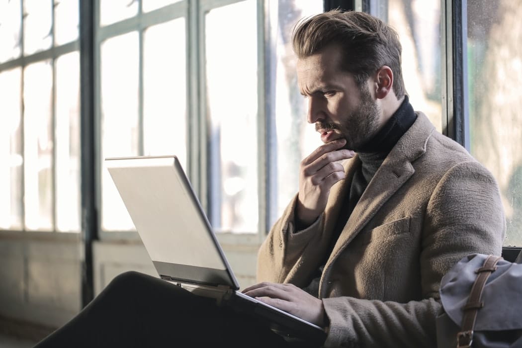 Man looking at laptop.