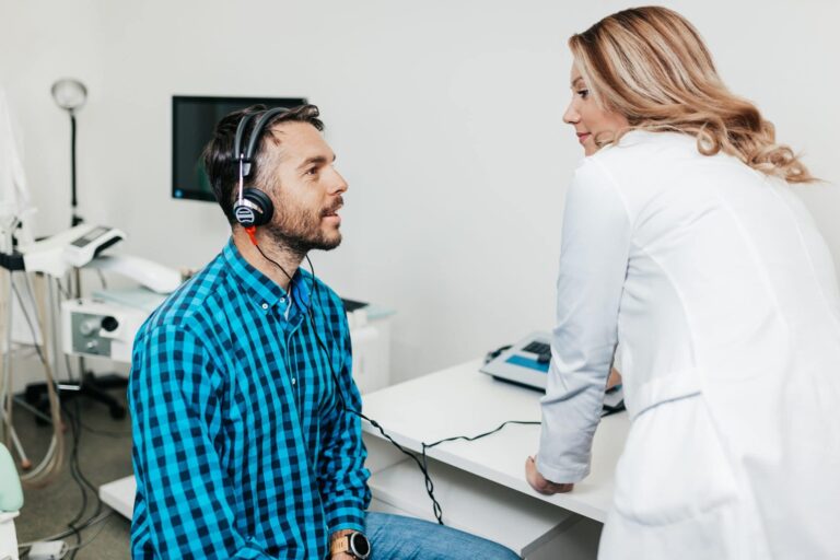 Medical hearing examination Man gets a hearing test.