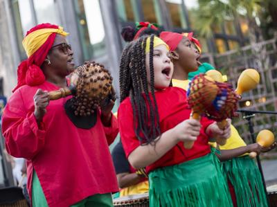 Performers at the MOJA Festival in Charleston playing loud music.